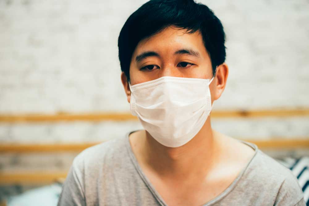 male patient wearing a face mask